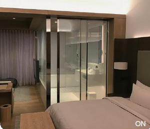 Smart glass partition in a hotel suite
