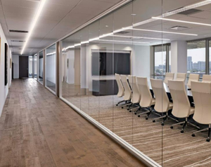 Smart glass conference room with clear glass partition